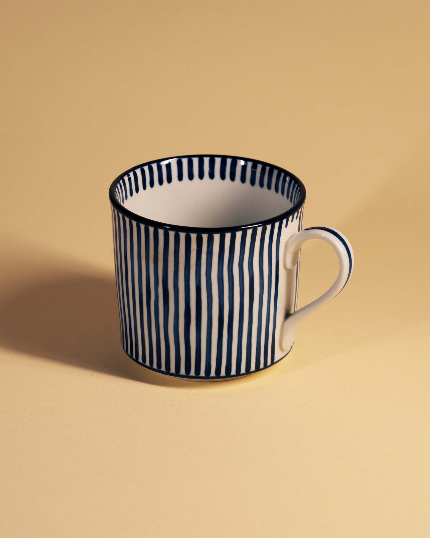 Blue and White Striped Ceramic Cup